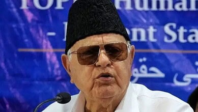 Image of Khamenei speaking at a press conference, with Farooq Abdullah in the background, highlighting re.