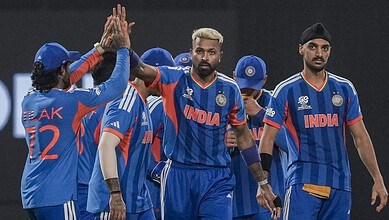 Indian cricket players celebrating during T20 World Cup match against West Indies.