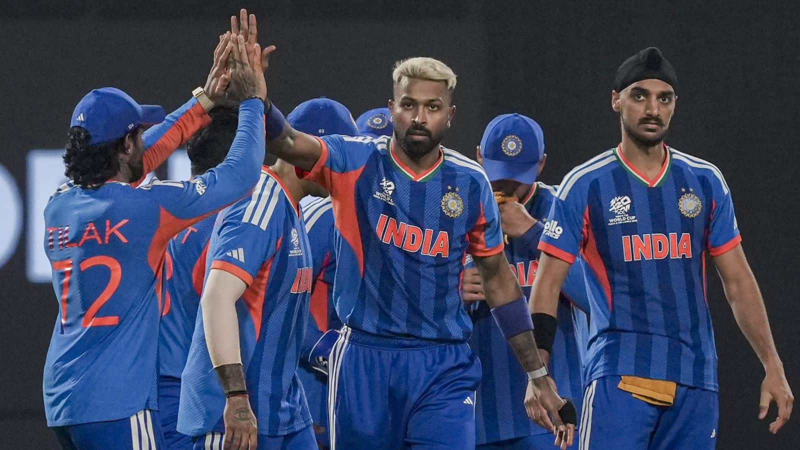 Indian cricket players celebrating during T20 World Cup match against West Indies.