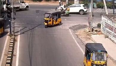 Drunk driver dragging traffic cop on bonnet at Gachibowli intersection in Hyderabad.