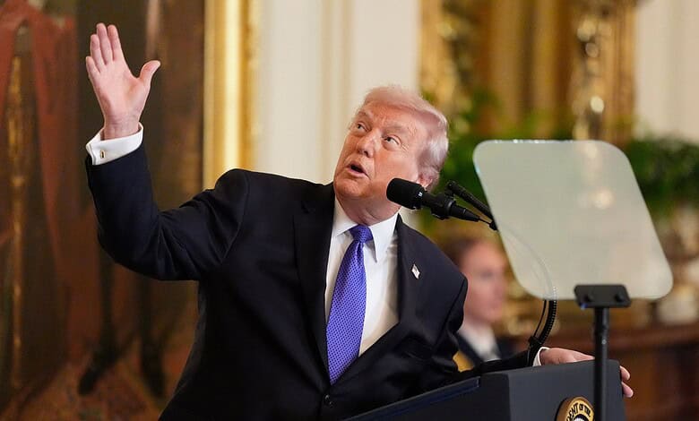 Donald Trump speaking at a podium during a press conference.