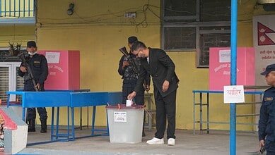 A man votes in Nepal's elections