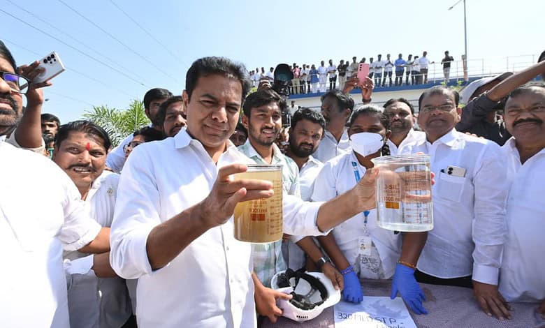 KTR holding water samples during a public event in Telangana, criticising Congress over 'bulldozer model'.