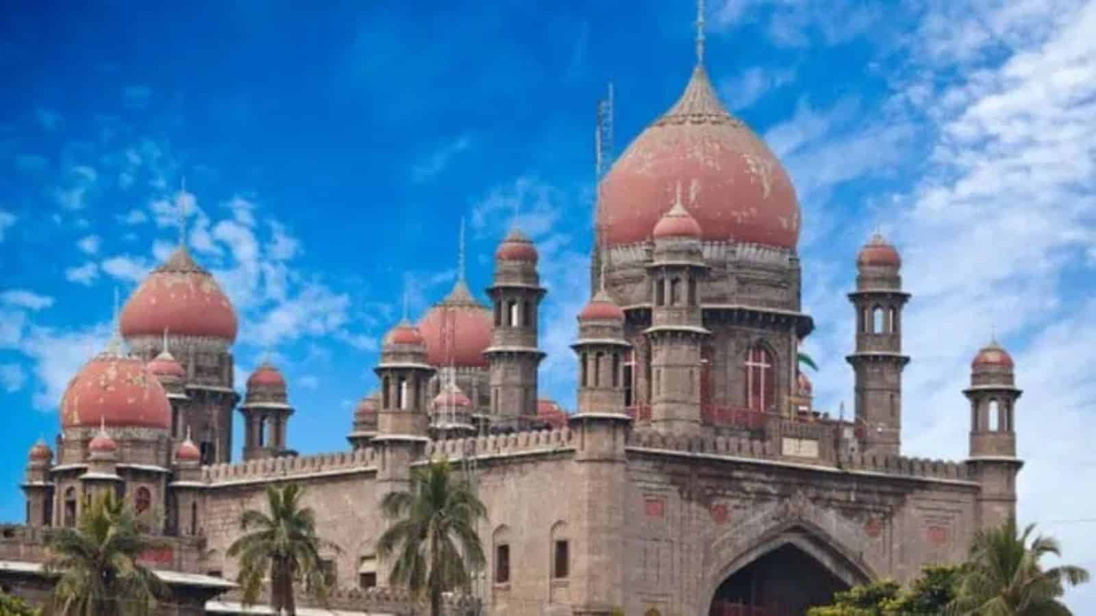 Historic Kaleshwaram palace with domes and minarets under a blue sky, surrounded by palm trees.