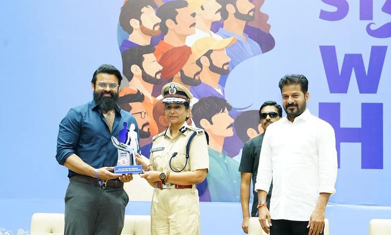 Police officer receiving an award at The Siasat Daily event promoting women's safety.
