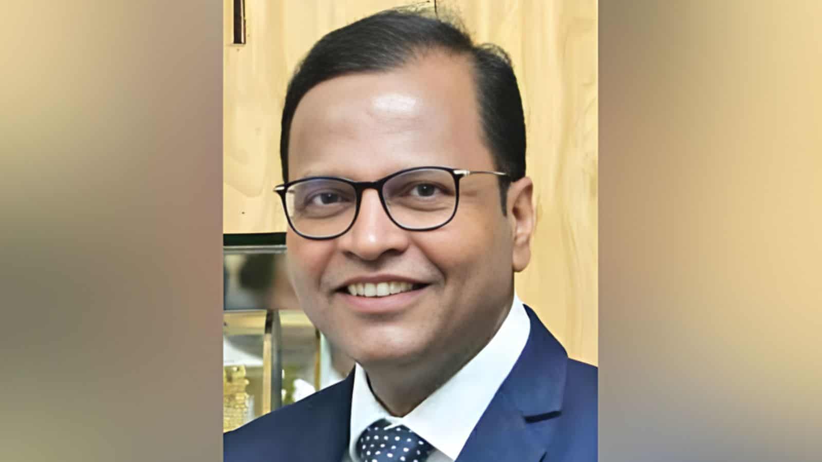 Portrait of Telangana Chief Secretary Ramakrishna Rao smiling in formal attire.