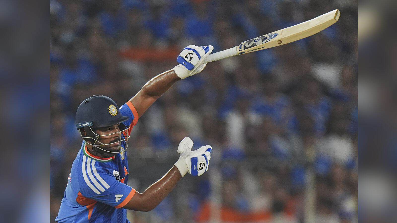 India cricket player hitting a six with a bat during the T20 World Cup final.