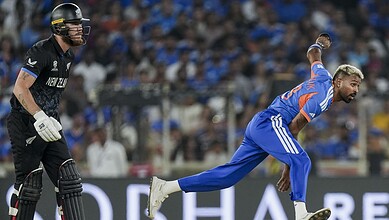 India cricket player celebrating a wicket during a match.