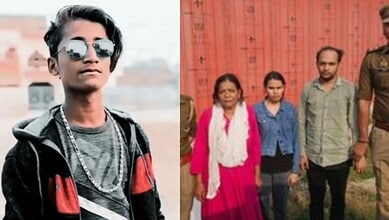 Young man with sunglasses and casual attire standing outdoors, with a group of people in the background.