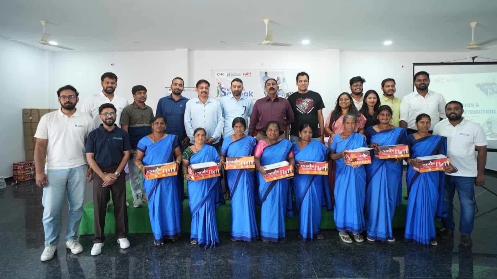Team of professionals receiving awards at The Siasat Daily event in a conference room.