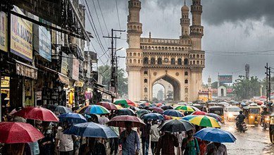 People with colourful umbrellas walking in Hyderabad during scattered rains near Charminar.