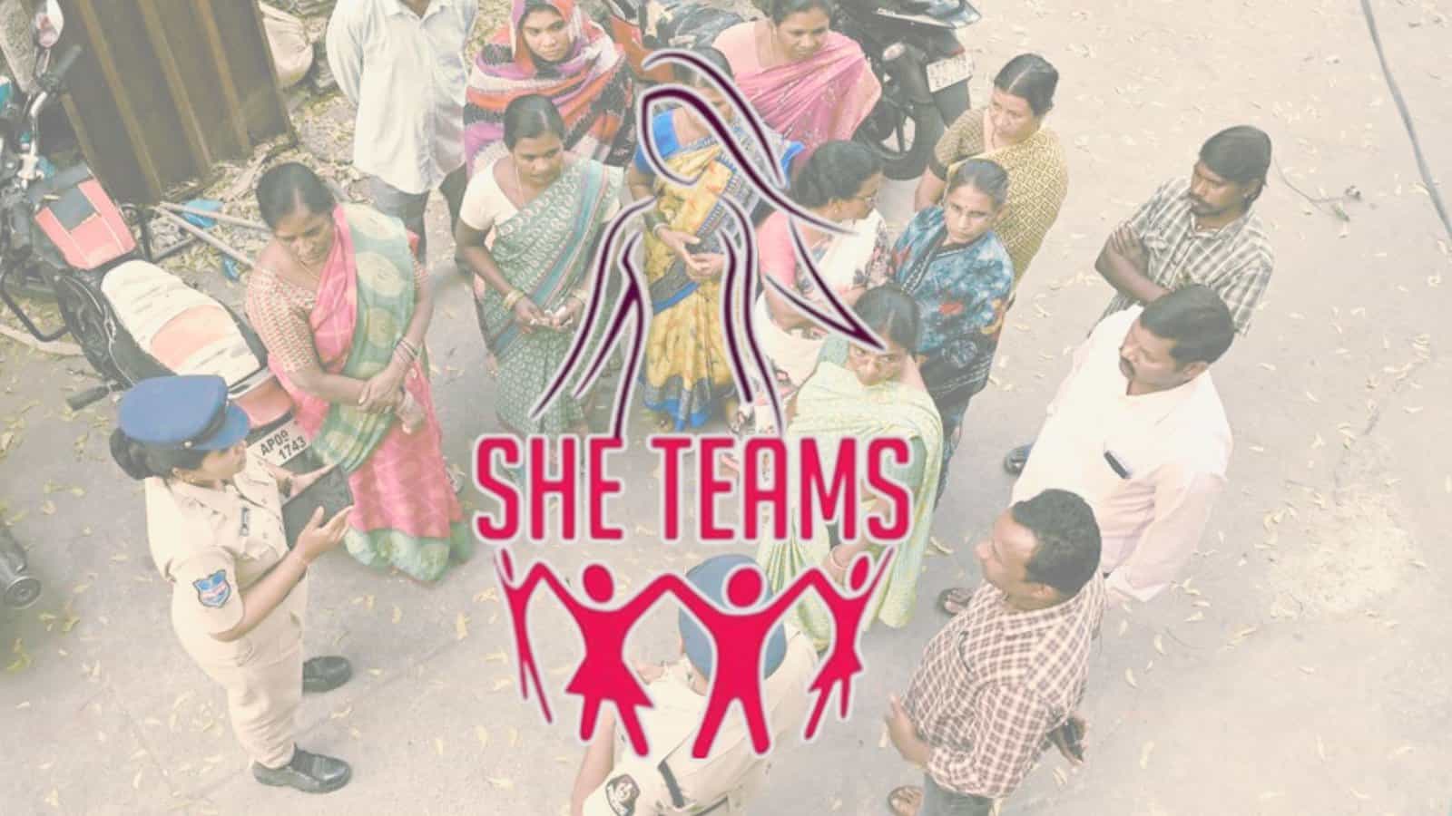 Women and police officers forming a circle, promoting SHE Teams initiative for women's safety.