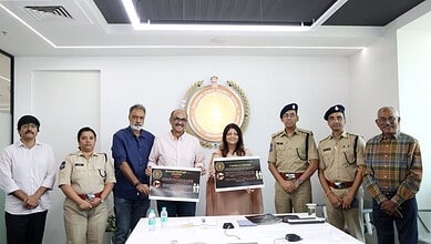 Group photo of officials unveiling new film piracy prevention guidelines in Telangana.