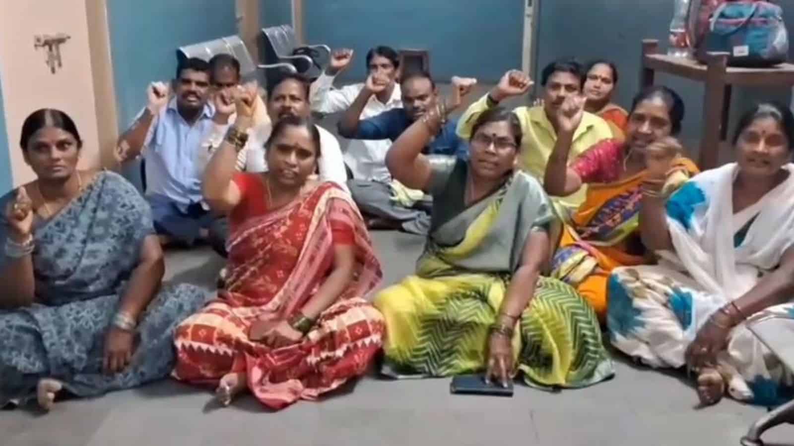 Group of contract workers protesting inside MGM hospital over unpaid wages in Telangana.