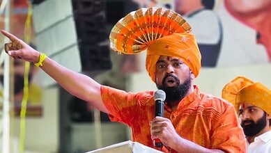 Raja Singh speaking passionately at a protest, refusing protection and criticizing officers who do not ap.