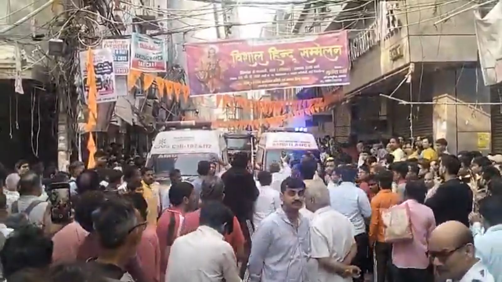 People gather outside building in Delhi