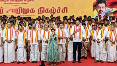 TVK President Vijay poses with his candidates for the Tamil Nadu elections