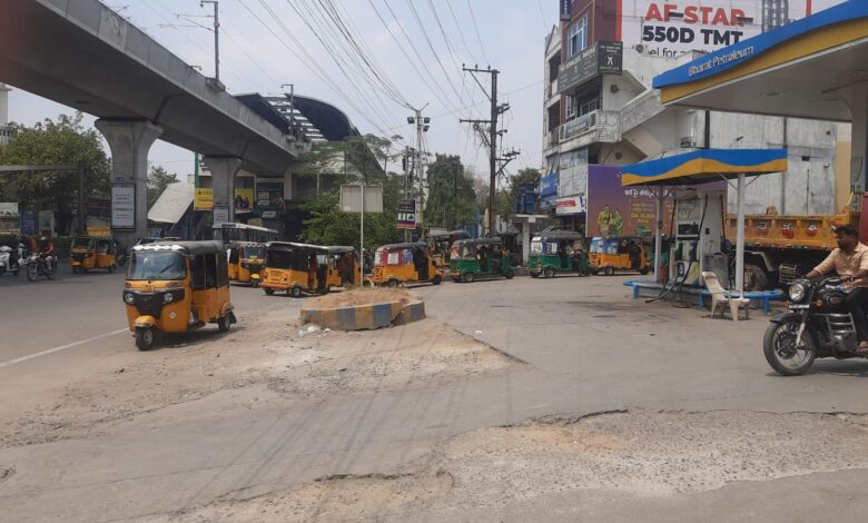Autos line up at a fuel station in Hyderabad