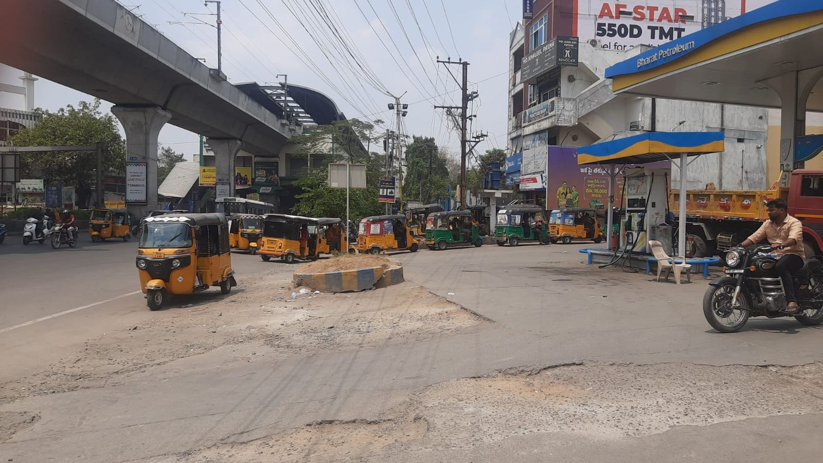 Autos line up at a fuel station in Hyderabad