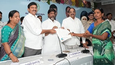 The image shows Telangana Deputy CM Bhatti Vikramarka and other ministers giving house site pattas to the evictees of Velugumatla huts demolition, at Khammam Collectorate on Wednesday, March 11.