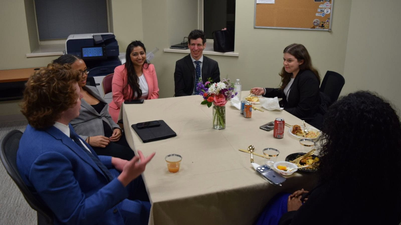 A Hyderabadi man speaking to a diverse group during Ramzan in Virginia, highlighting cultural unity and c.