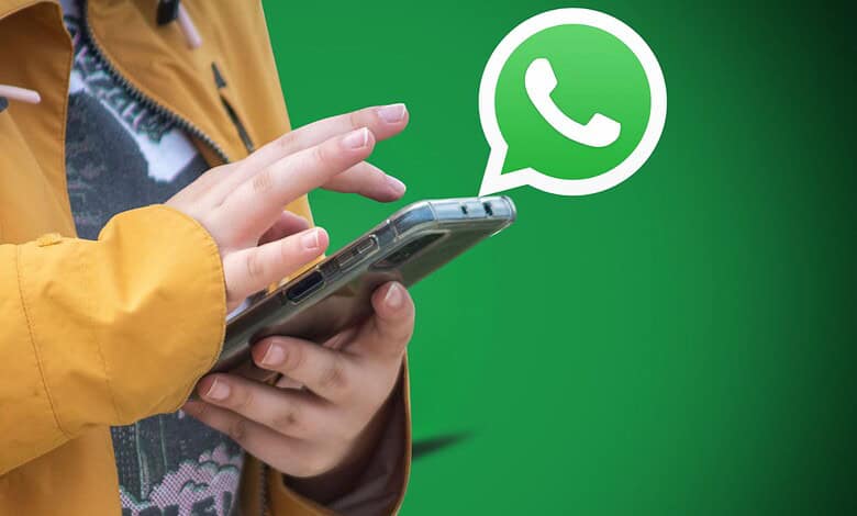 Person using a smartphone with WhatsApp logo, highlighting new parental control features for children und.