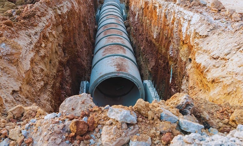 Image shows a drainage pipe in the ground