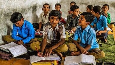 School children studying in classroom, highlighting education gaps in Telangana.
