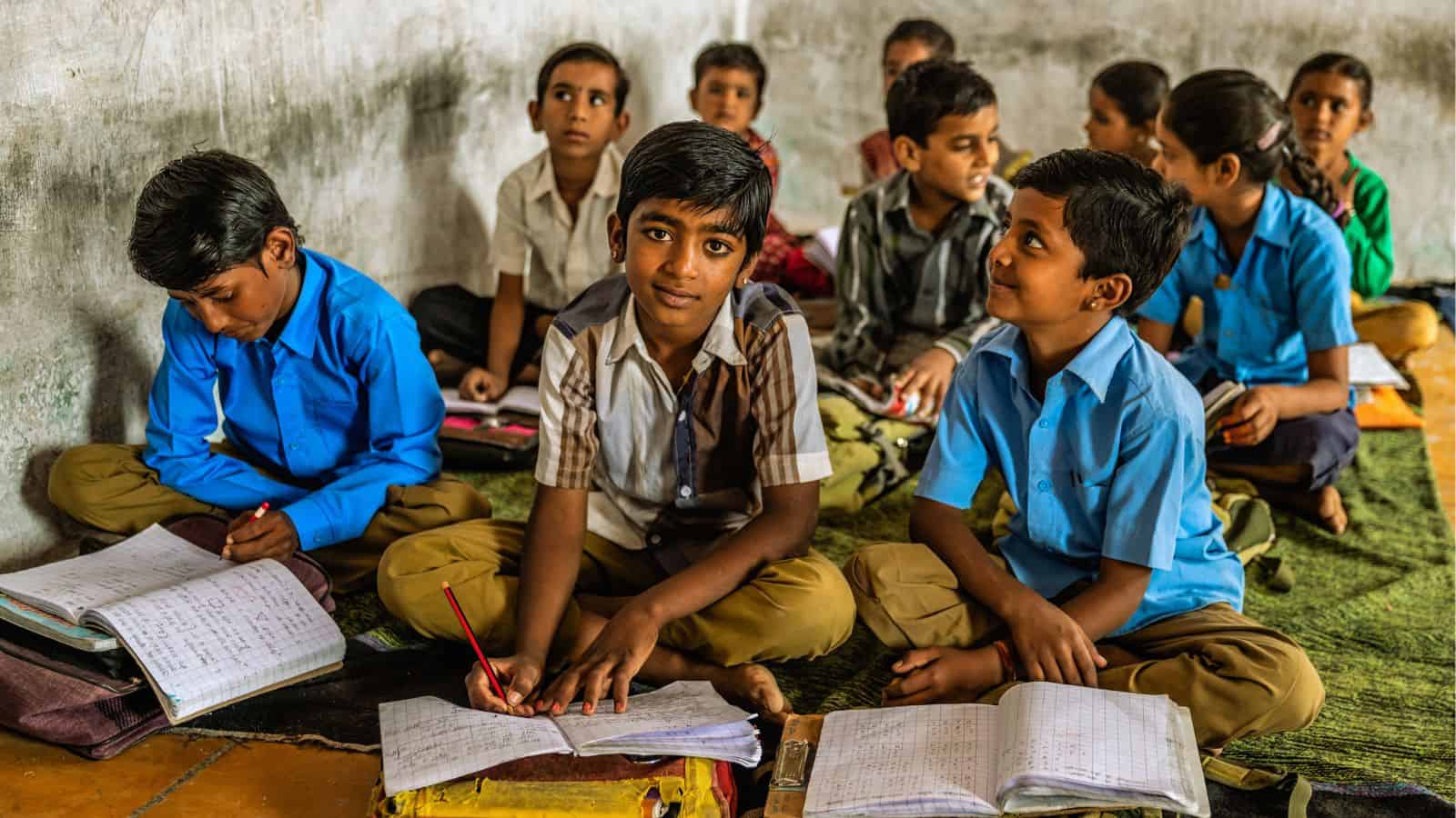 School children studying in classroom, highlighting education gaps in Telangana.
