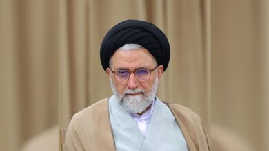 Portrait of Esmaeil Khatib wearing a black turban and glasses