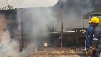 Fire at scrap shop in Hyderabad's KPHB Colony, with firefighters working to control the blaze and prevent.