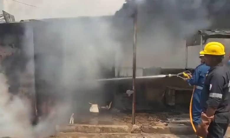 Fire at scrap shop in Hyderabad's KPHB Colony, with firefighters working to control the blaze and prevent.