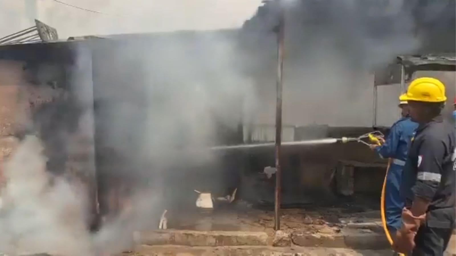 Fire at scrap shop in Hyderabad's KPHB Colony, with firefighters working to control the blaze and prevent.