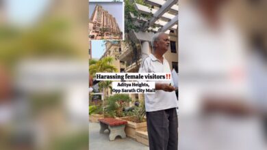 Image shows A man standing in the courtyard of a gated residential complex, with text overlay alleging harassment of female visitors at Aditya Heights, opposite Sarath City Mall.
