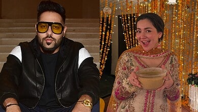 Badshah attending Hania Aamir’s wedding, dressed stylishly with sunglasses and a black jacket.