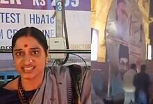 Madhavi Latha tears down AIMIM iftar posters in front of Virinchi Hospital during a political demonstrati.