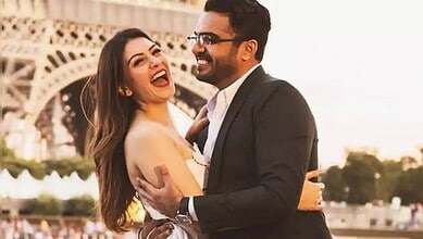 Happy couple Hansika Motwani and Sohael Khaturiya embracing in front of the Eiffel Tower in Paris.