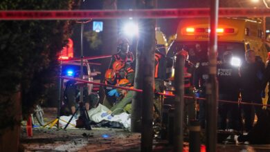 Israeli first responders remove the body of a person killed in an Iranian missile strike in Tel Aviv, Israel, early Saturday, March 28, 2026. AP/PTI
