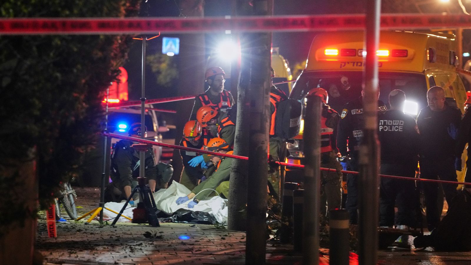 Israeli first responders remove the body of a person killed in an Iranian missile strike in Tel Aviv, Israel, early Saturday, March 28, 2026. AP/PTI
