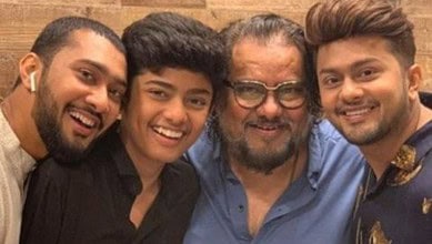 Family enjoying a joyful moment together, highlighting religious diversity and unity.