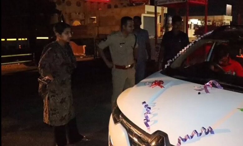 Police officers inspecting decorated vehicle during Operation Kavach.