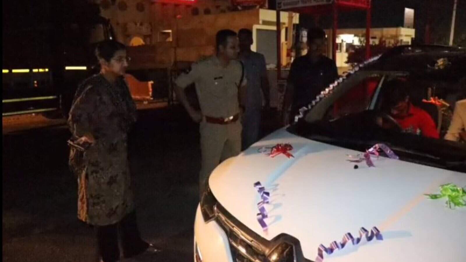 Police officers inspecting decorated vehicle during Operation Kavach.