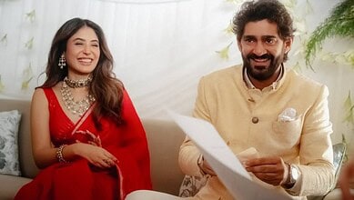 Kritika Kamra and Gaurav Kapur smiling together at a media event.