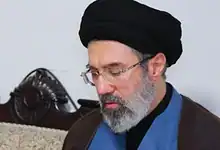 Mojtaba Khamenei wearing black turban and glasses.