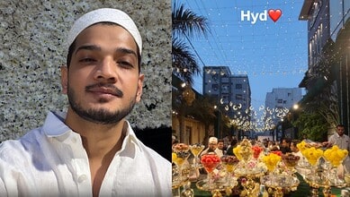 Munawar Faruqui enjoying Iftaar daawat in Hyderabad, surrounded by festive lights and floral arrangements.
