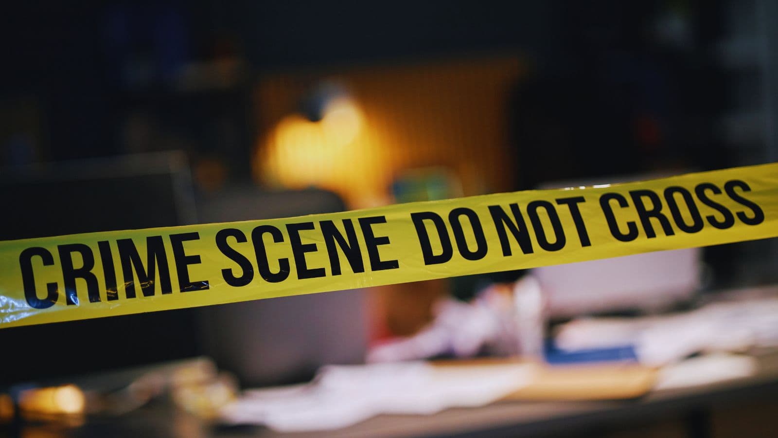 Crime scene photo showing police tape at a construction site in Hyderabad after a double murder.