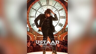 Promotional poster for Usthad Bhagat Singh pre-release event with a man in a suit and hat in front of a c.