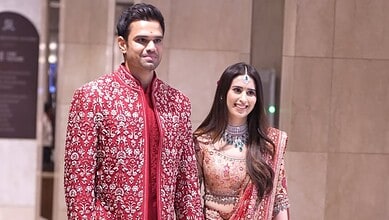 Saaniya Chandhok dressed in traditional attire at a formal event, smiling confidently.