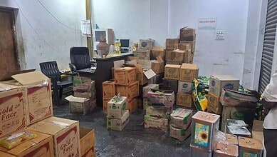 Seized adulterated cooking oil and wheat flour worth Rs 21 lakh in Hyderabad, displayed in a storage room.