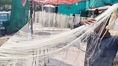 Artisan weaving handmade seviyah for Eid celebrations in Hyderabad, showcasing traditional craftsmanship.